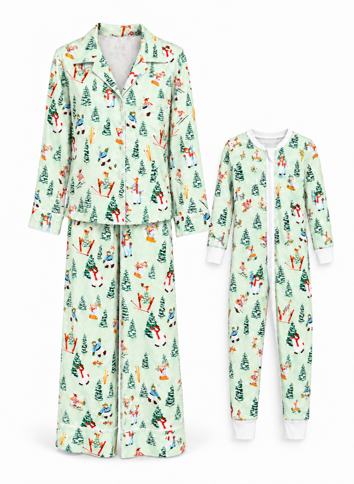 A matching pajama set shown on a white background, including a long-sleeve button-front top and pants set on the left, and a one-piece pajama set on the right. Both sets have a light mint green base with a festive Christmas print featuring pine trees, snowmen, Santa Claus, and snowmobiles.