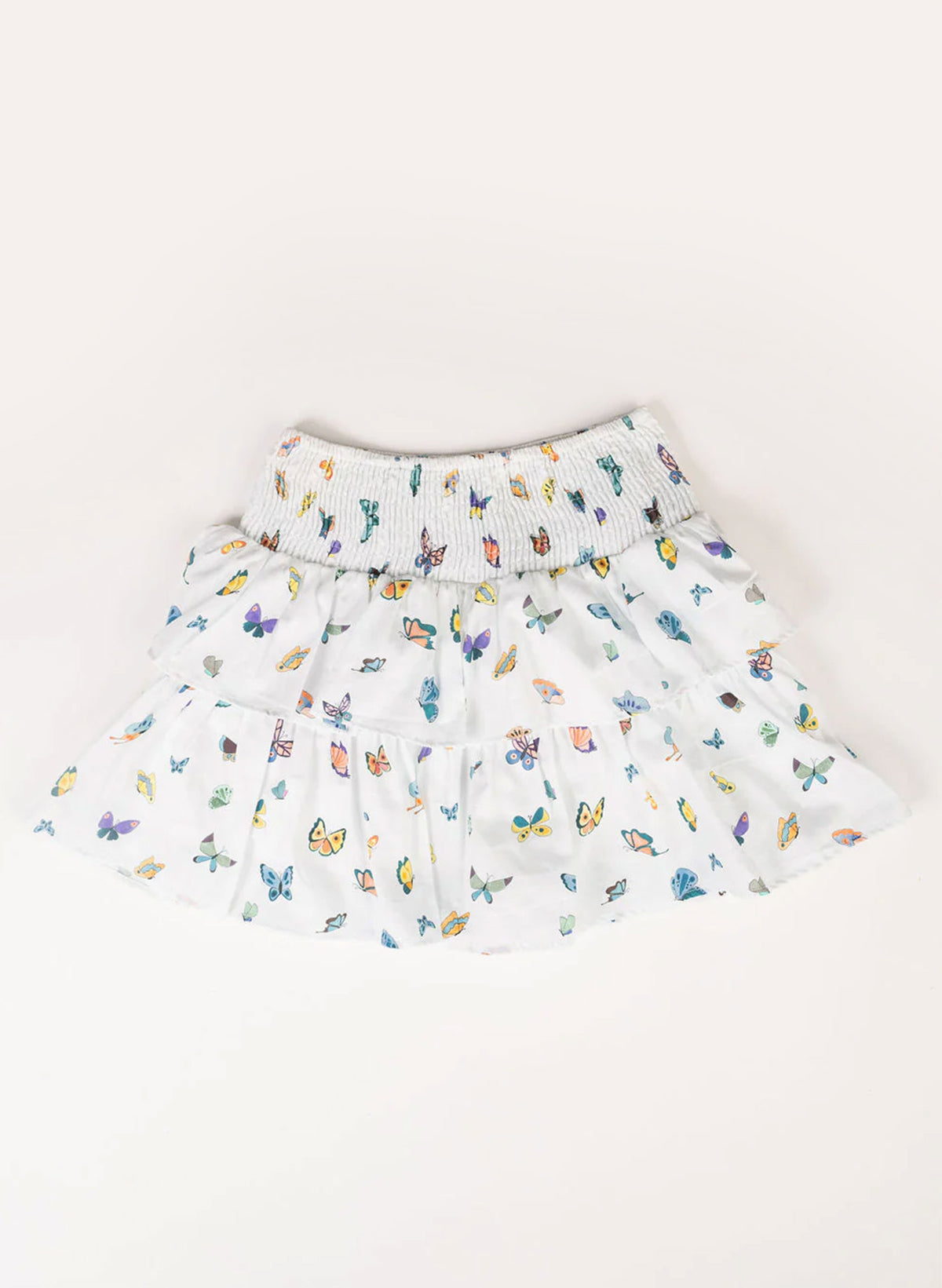 White skirt with colorful butterfly pattern on a white background