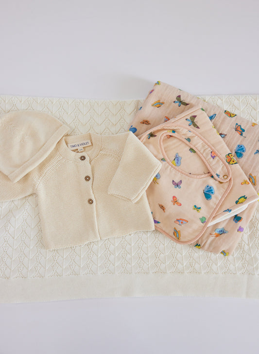 The Perfect Newborn Gift Blush Peach Bib, Burp and Shawl Blanket, Cardigan and Wander Blanket.