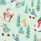 A close-up of a light mint green fabric with a repeating winter ski pattern featuring snowmen, pine trees, skis, and red boots.