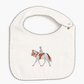 An off-white cotton baby bib with scalloped edges, featuring an embroidered illustration of a horse and rider in the center.