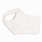 A white baby bib with a matching square cloth, both featuring the word 'l'amour' embroidered in light pink script, set against a plain white background.