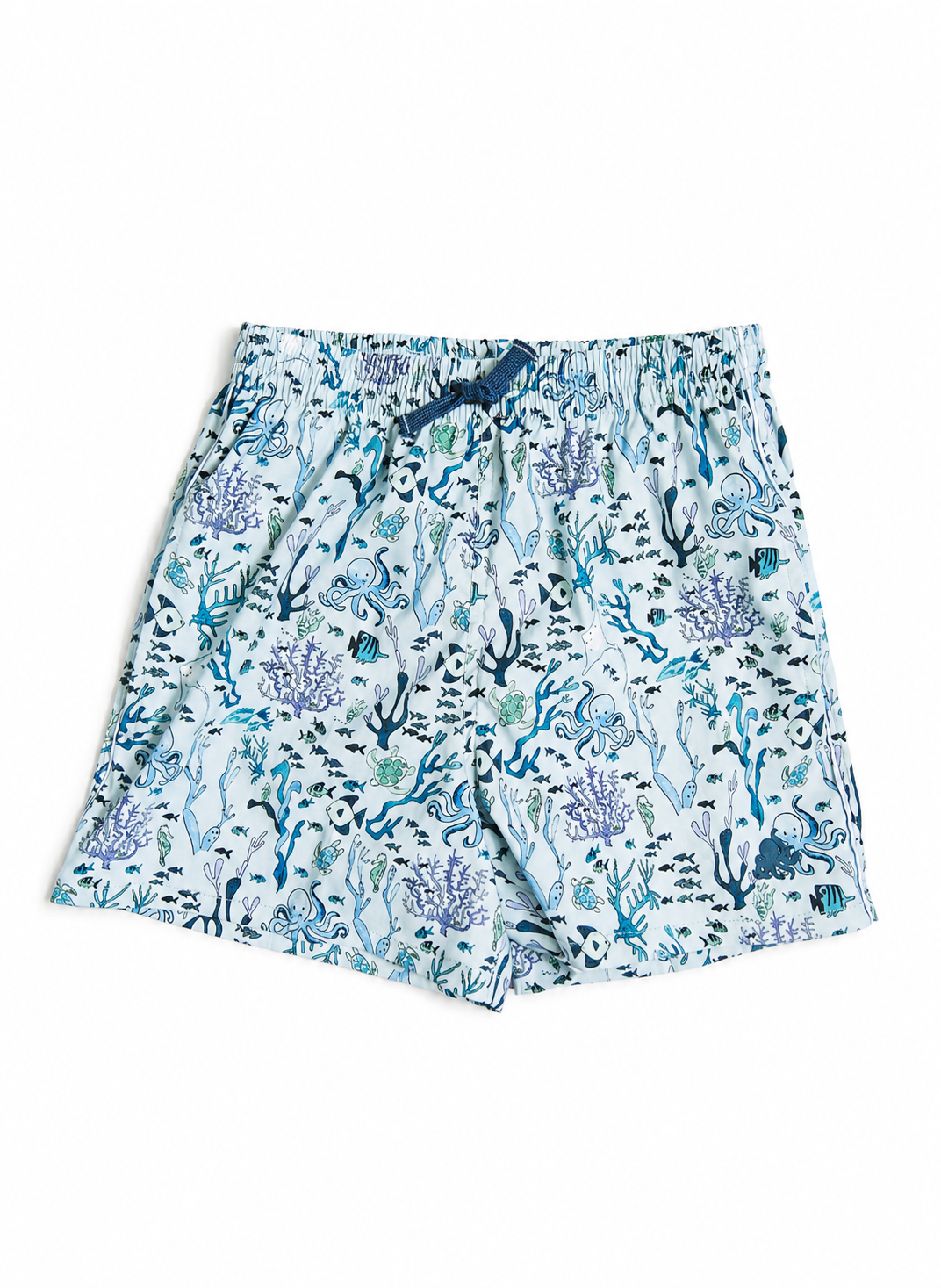 A pair of kids' shorts featuring an all-over blue and purple underwater coral print on a white background, with a dark blue elastic waistband.