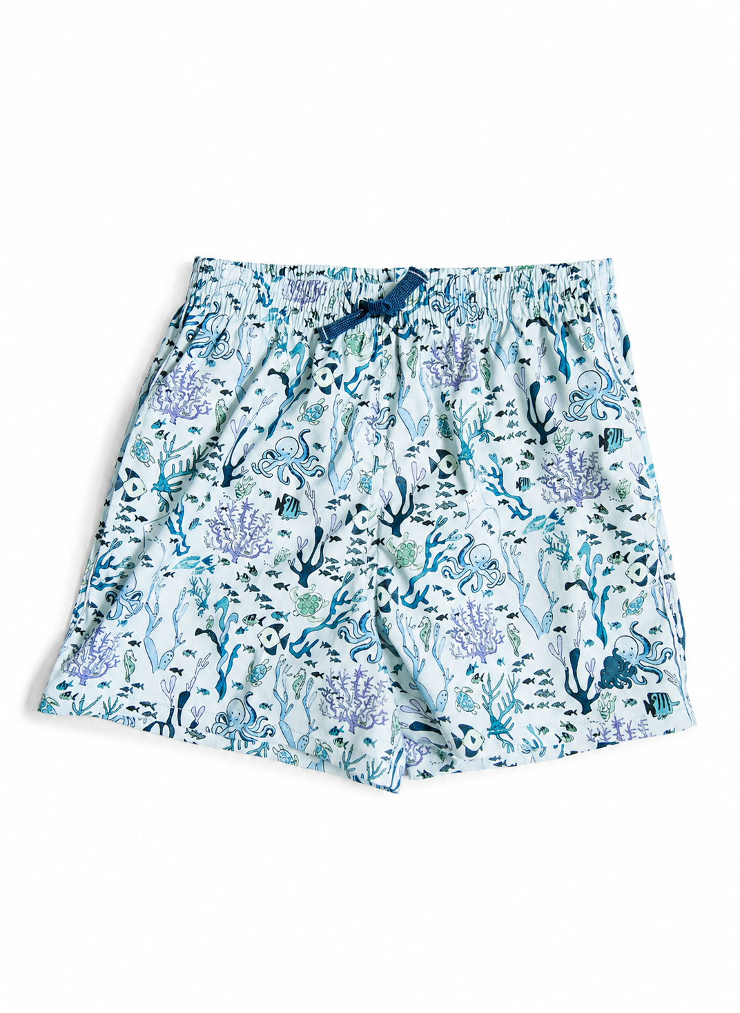 A pair of women's shorts featuring an all-over underwater coral and sea plant print in shades of blue, purple, and teal on a white background, complete with an elastic waistband and a small blue bow detail.