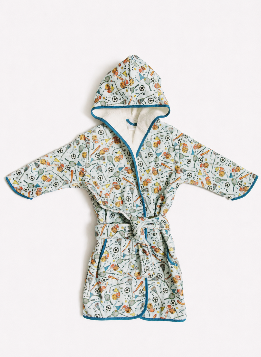 A hooded cotton robe with a colorful floral and botanical print, featuring teal blue piping and a matching tie belt, laid flat against a light off-white background.