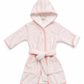 A light pink hooded bathrobe with a matching tie belt, featuring a subtle tonal pattern and contrasting pink trim, shown against a plain white background.