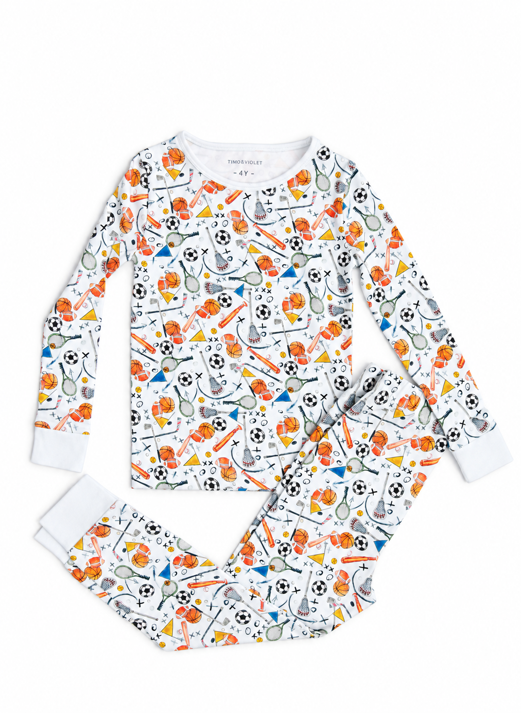 A two-piece children's pajama set featuring a long-sleeve top and matching pants, both printed with a colorful sports-themed pattern of soccer balls, tennis rackets, bats, and balls on a white background.