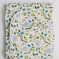 Baby blanket with monkey and leaf pattern on a white background