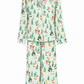 A two-piece pajama set featuring a long-sleeve button-front top and matching wide-leg pants, both in a pale mint green fabric with a colorful winter-themed print of skiers, snowboarders, and Christmas trees.