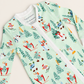 A long-sleeve baby zip-up sleeper by Tim & Mary in mint green, featuring a colorful allover print of skiers, snowboarders, and skis.