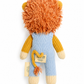 A handmade knitted lion doll by Vivlet, featuring a fluffy orange mane, yellow and cream arms and feet, and a light blue body, shown against a plain white background.