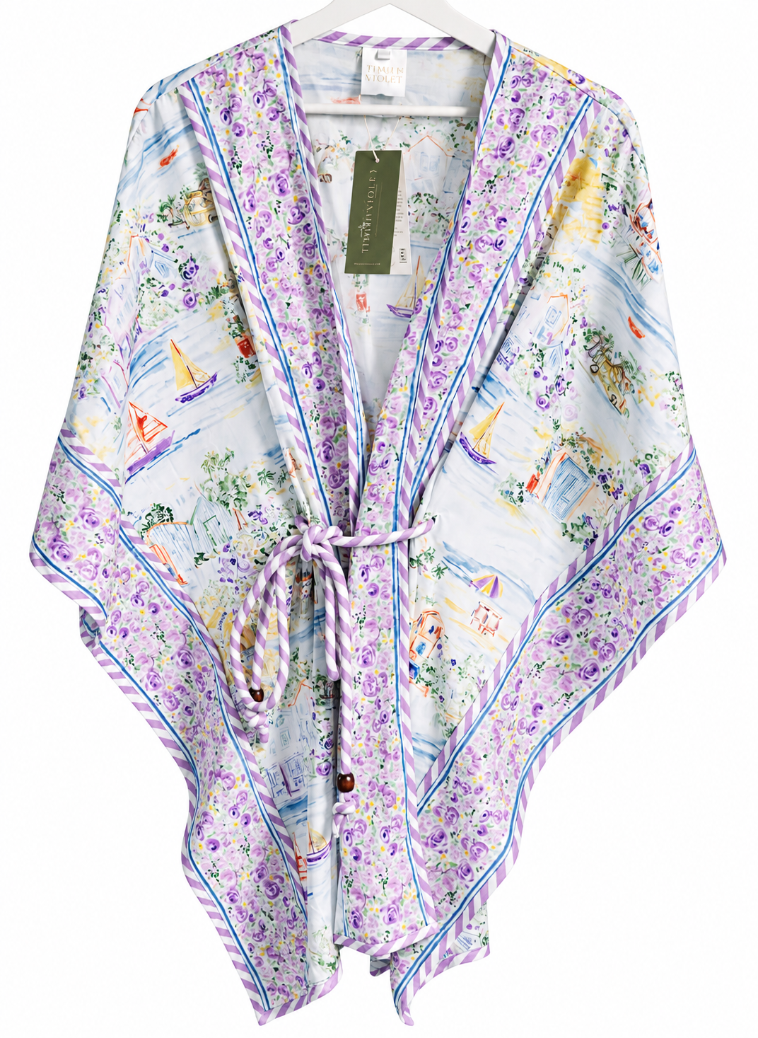 A lightweight wrap kimono with a lavender and blue floral border and a multicolor toile-style print featuring sailboats and figures on a white background, shown hanging on a white hanger.