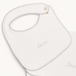 A white baby bib with a scalloped edge and the word 'love' embroidered in gray script, shown on a clean white background.