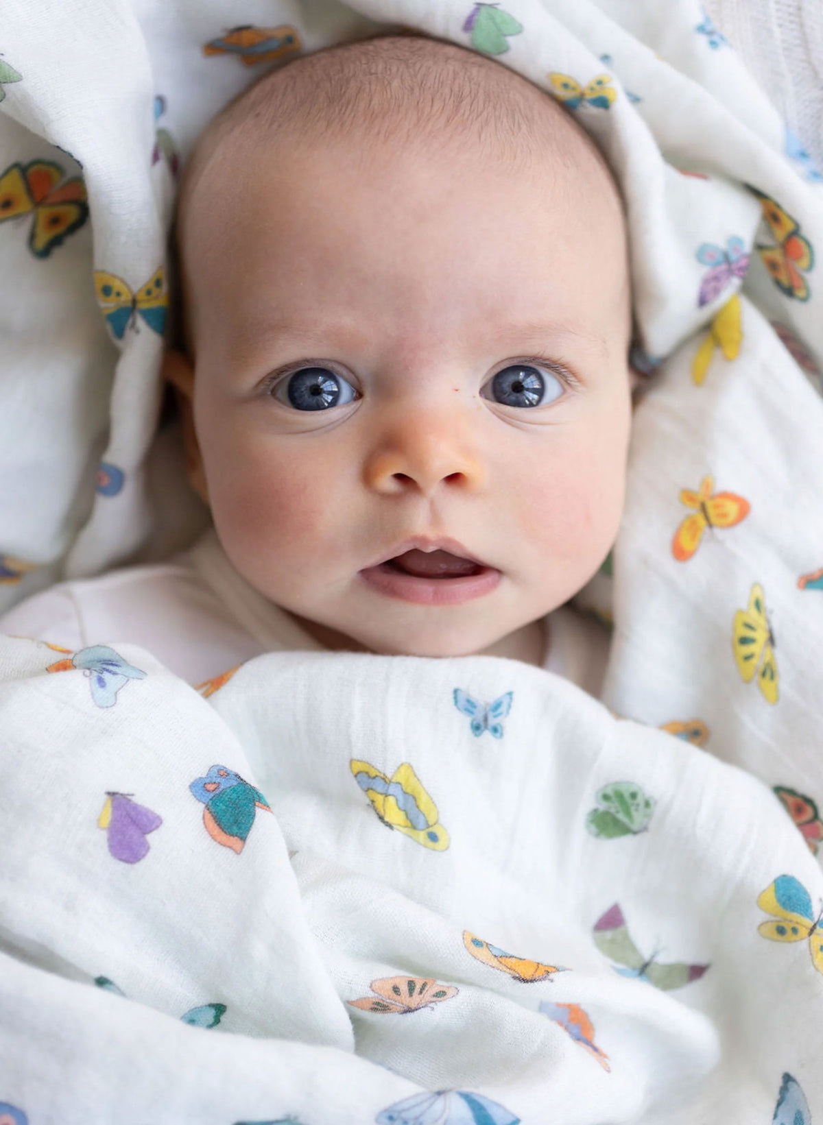Organic cotton muslin shawl blanket by Timo & Violet