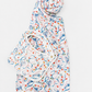 A white baby wrap or burp cloth with a colorful abstract pattern of blue, orange, and yellow swirls, folded and rolled on a light gray background.