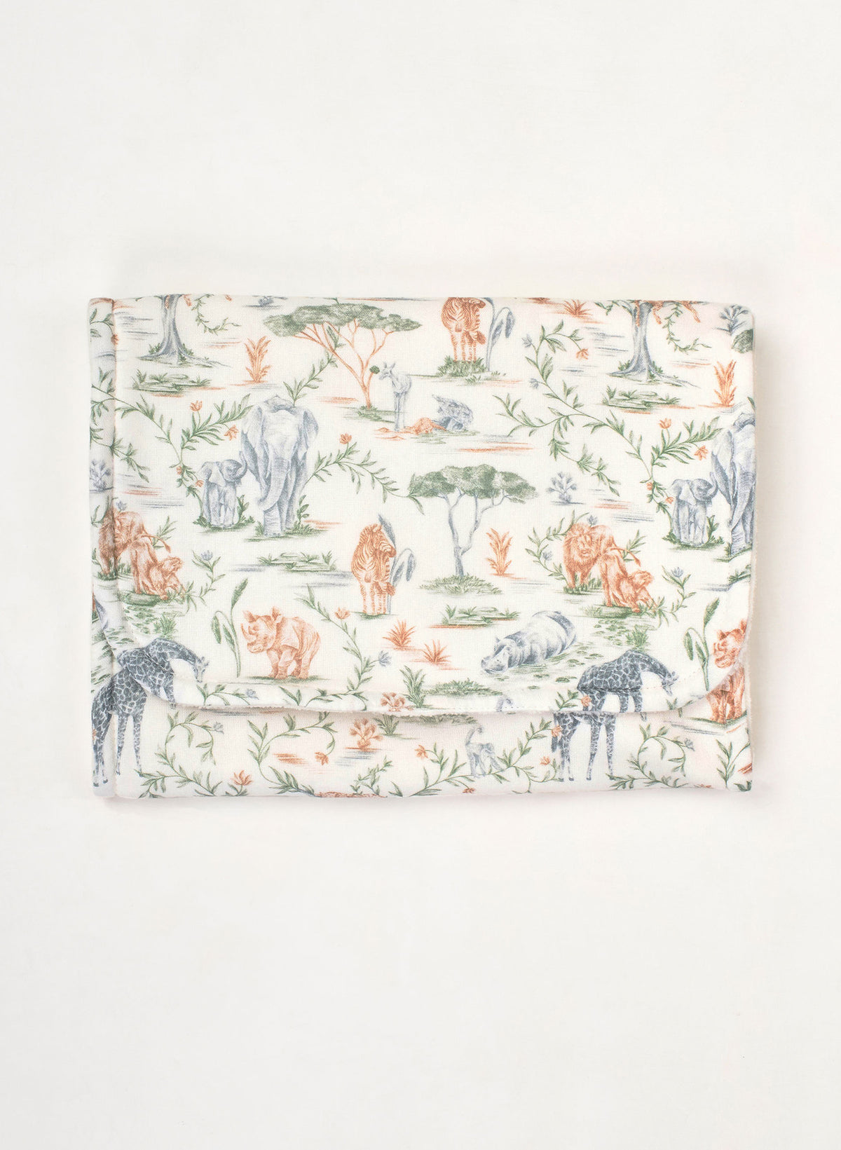 A folded fabric item, likely a blanket or cloth bag, featuring a toile-style safari print with animals and foliage on a cream background.