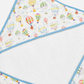 A close-up of a hooded baby towel showing the printed outer fabric with colorful hot air balloons on a white background and a light blue trim, alongside the soft white plush inner lining.