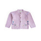Pink baby cardigan with butterfly patches on a white background