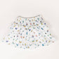 White skirt with colorful butterfly pattern on a white background