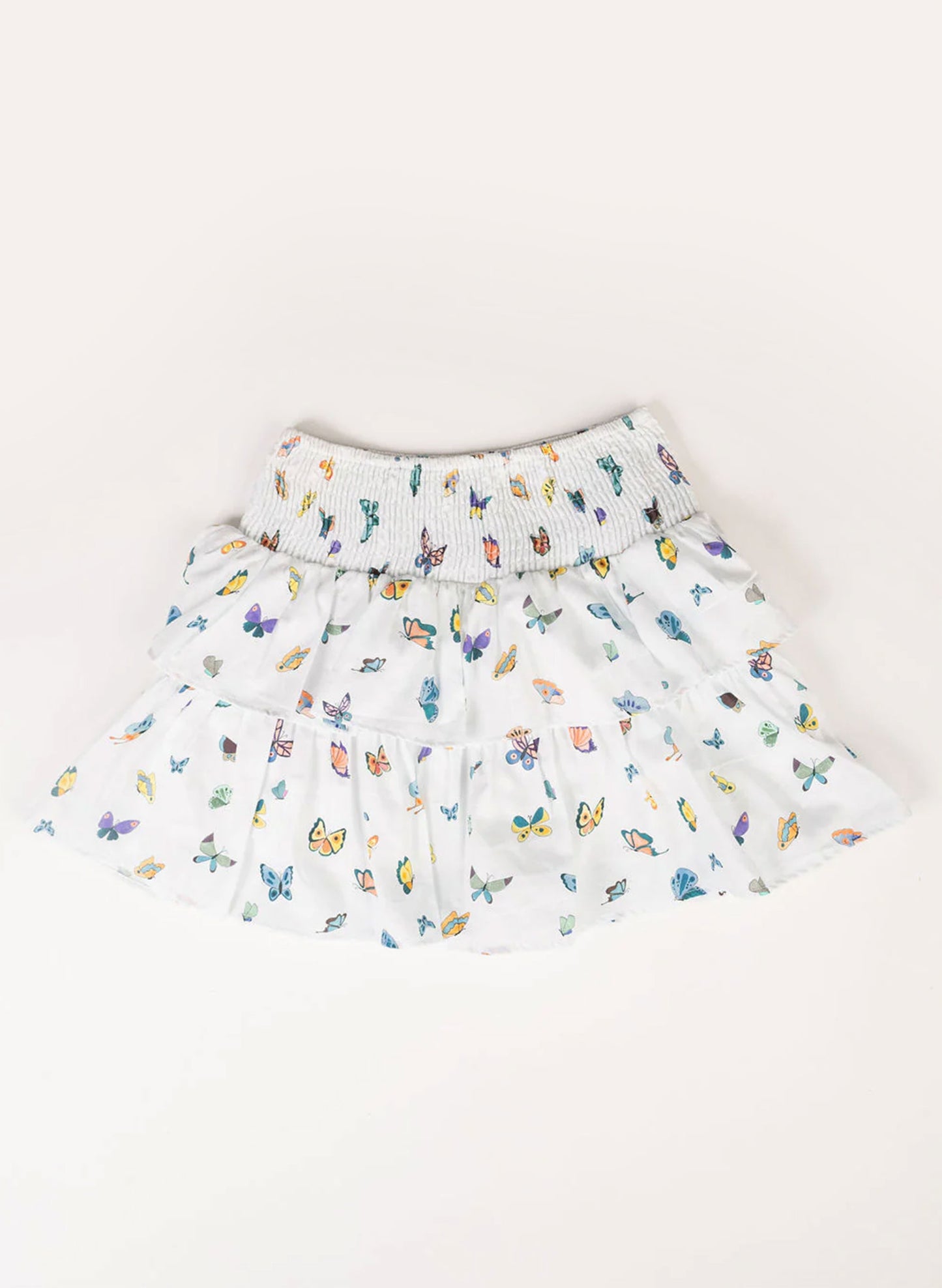 White skirt with colorful butterfly pattern on a white background